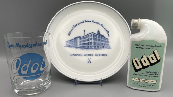 Glas, um 1920, Wandteller, um 1950 und Jubiläumsflasche, 1993, von Odol