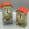 Konvolut aus zwei Spar-Uhren, mechanische Blech-Spardosen, mit bunten Kinderszenen, D.R.G.M., 1930er Jahre
